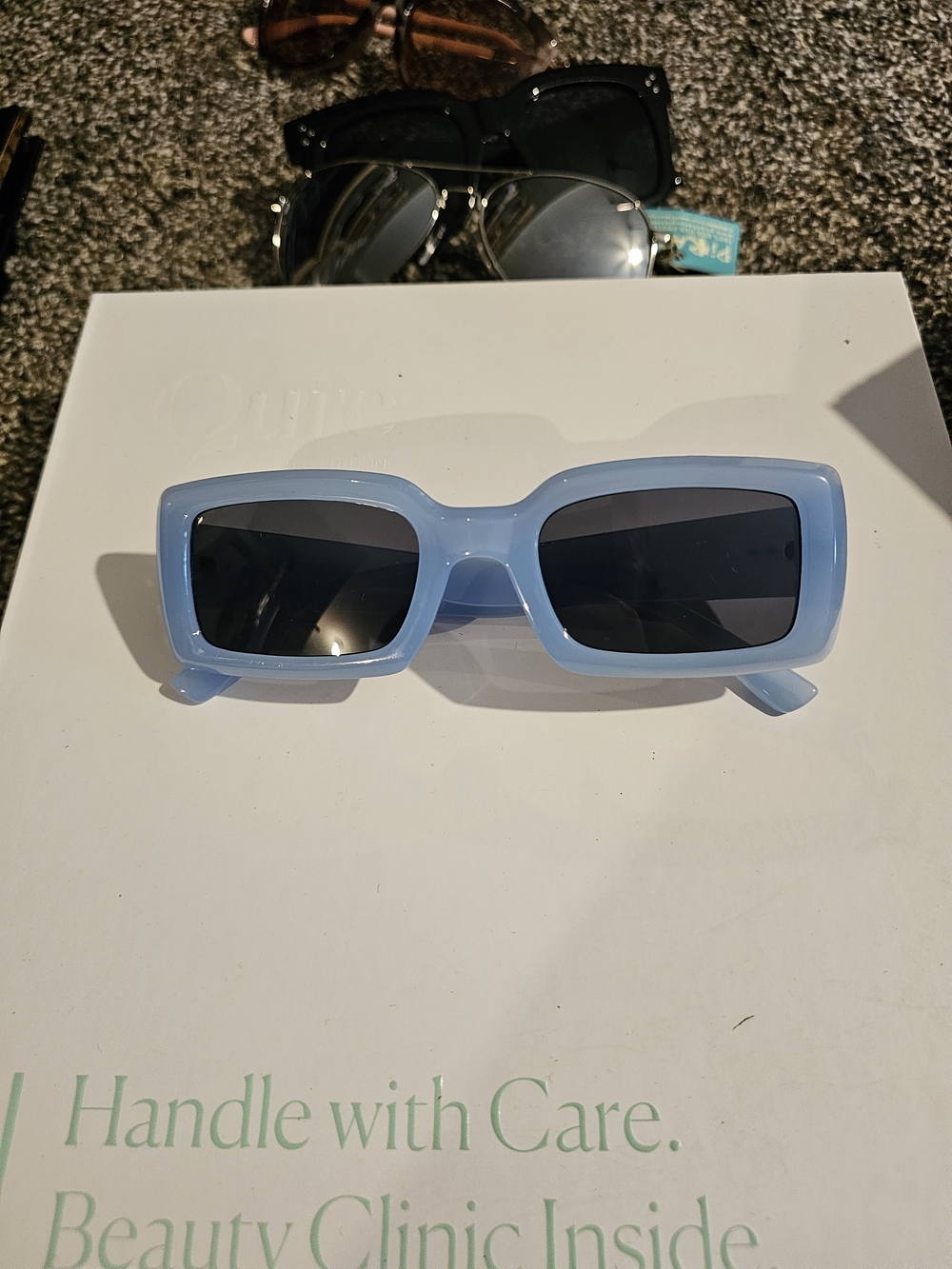 Womenβs Rectangular Light Blue Sunglasses with Dark Lenses
